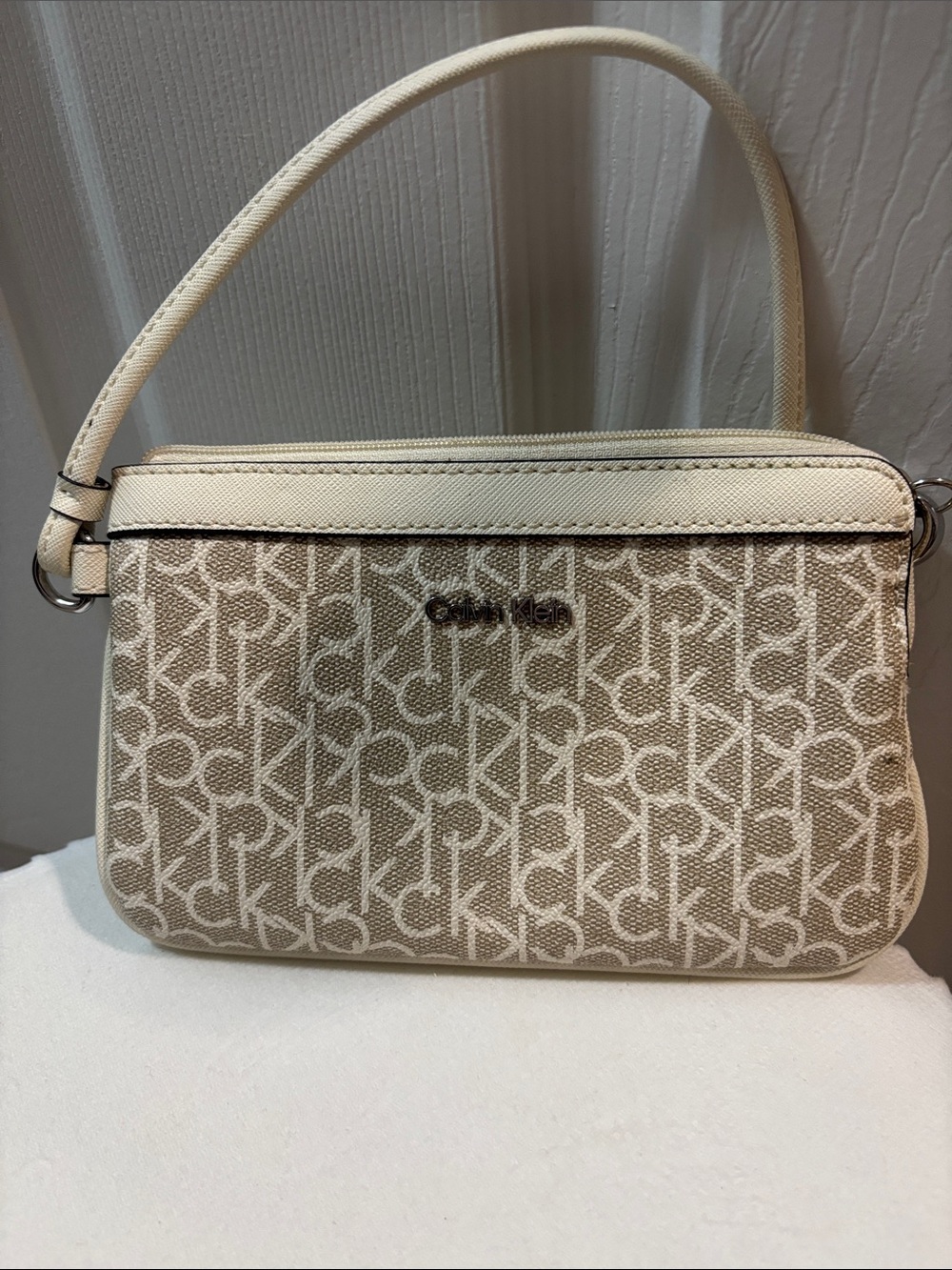 Calvin Klein Beige Monogram wristlet with Cream Trim